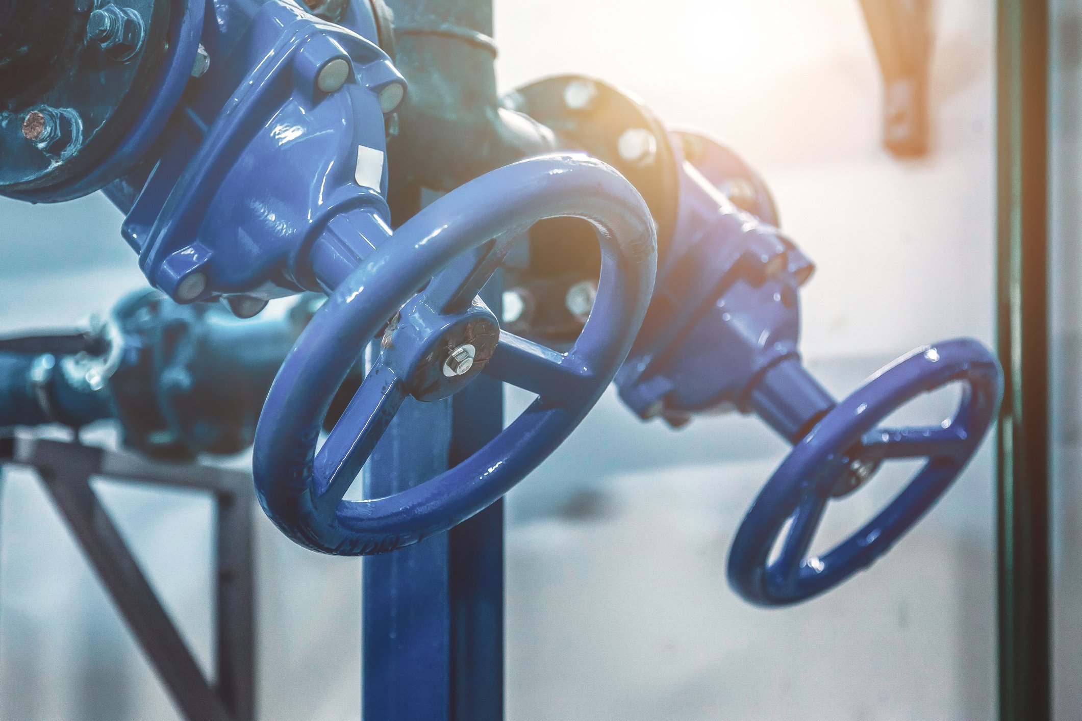 A Close Up Of A Blue Valve On A Pipe