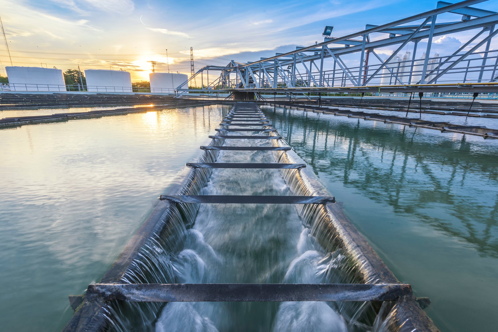 a large water treatment plant during sunset